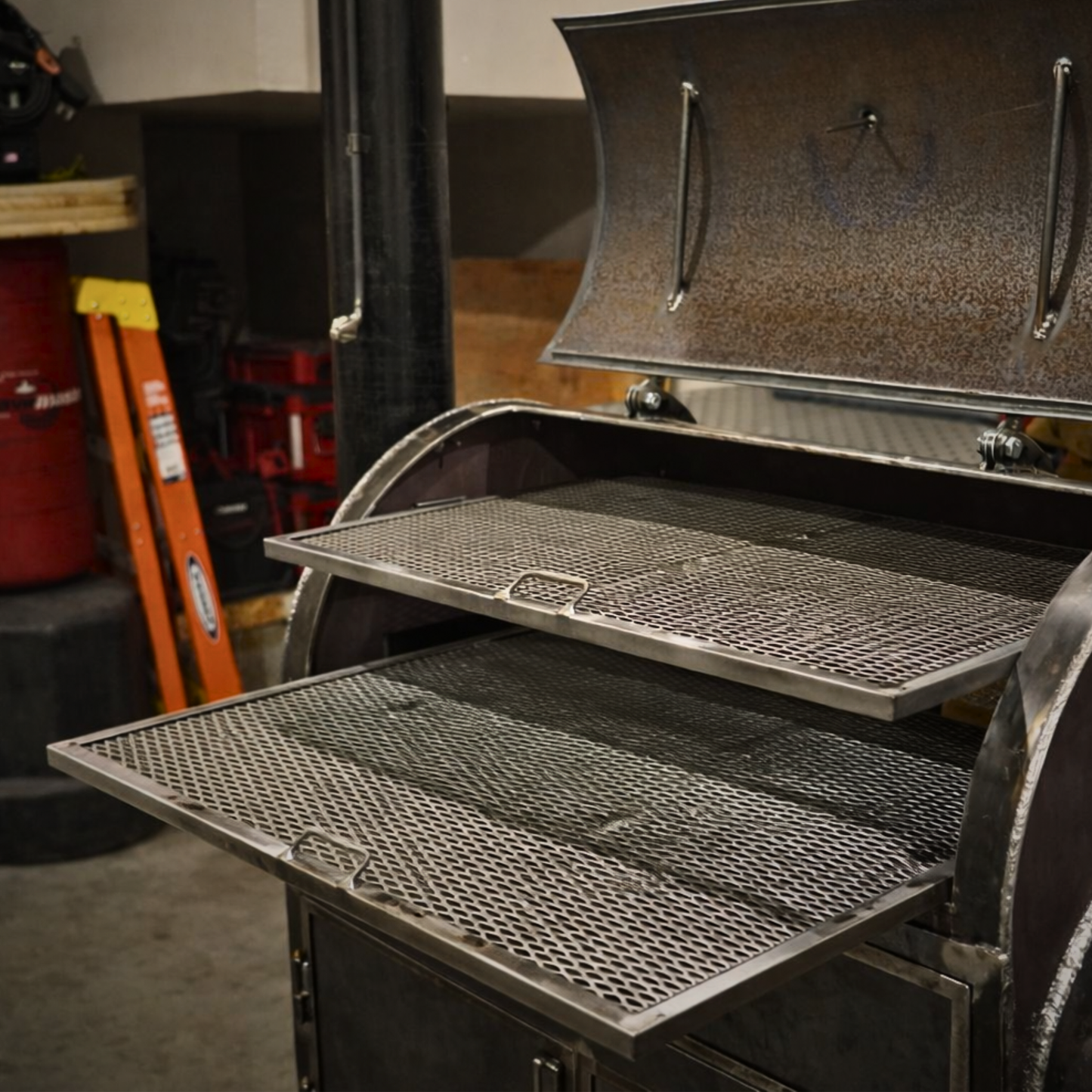 Removable steel cooking grates pulled out of the 80-Gallon King offset smoker