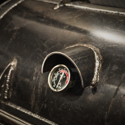 Temperature gauge welded into the cooking chamber of the 80-Gallon King offset smoker